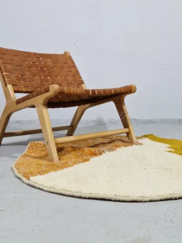 Round ivory and mustard wool rug for modern interiors